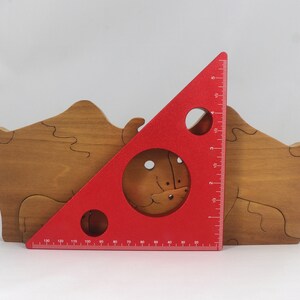Wooden 6-piece bison family puzzle with two adult bison and four calves. The hardwood pieces interlock into one standing group or separate to stand alone. Handnmade in Tallahassee, Florida, USA by Odin's Toy Factory.