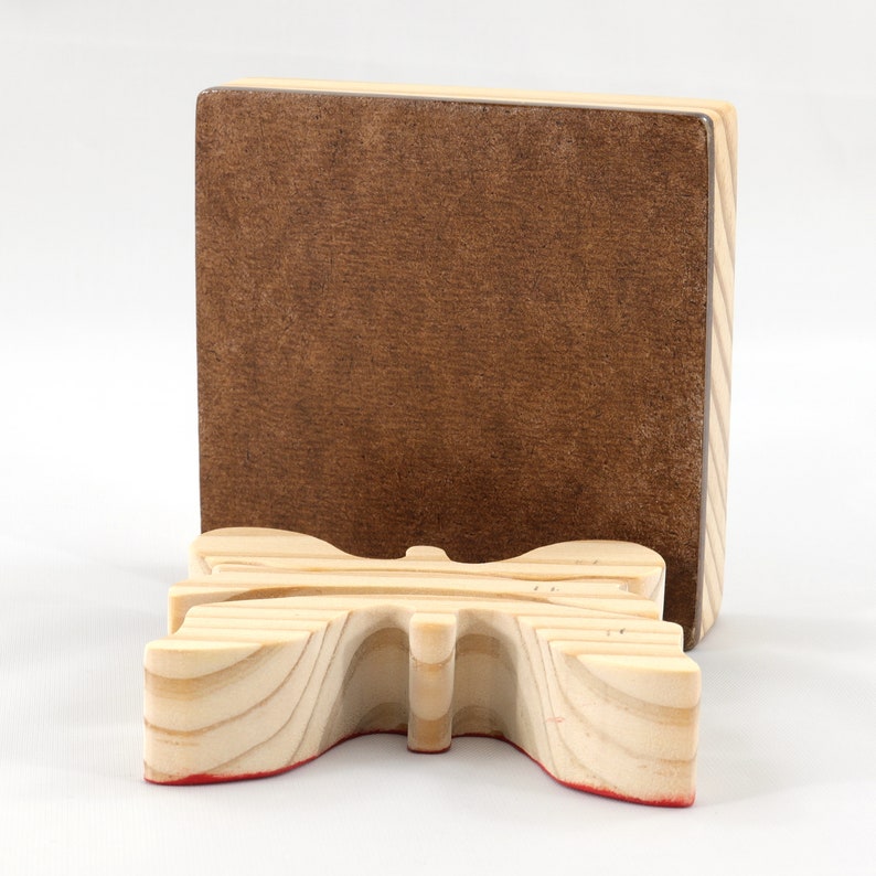 A wooden three-piece butterfly tray puzzle, handmade and finished. The butterfly is painted bright red and yellow with orange spots. The wooden tray is finished with clear shellac. It is one of four puzzles in my Puzzle Pals Collection.