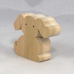 Handmade, stackable toy puppy dog cutout from the Itty Bitty Animal Collection. Unfinished and unpainted, crafted for creative play. Smoothly sanded and ready to be personalized with your favorite colors.