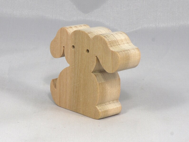 Handmade, stackable toy puppy dog cutout from the Itty Bitty Animal Collection. Unfinished and unpainted, crafted for creative play. Smoothly sanded and ready to be personalized with your favorite colors.