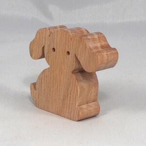 Handmade, stackable toy puppy dog cutout from the Itty Bitty Animal Collection. Unfinished and unpainted, crafted for creative play. Smoothly sanded and ready to be personalized with your favorite colors.