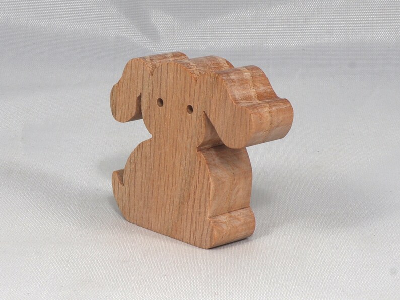 Handmade, stackable toy puppy dog cutout from the Itty Bitty Animal Collection. Unfinished and unpainted, crafted for creative play. Smoothly sanded and ready to be personalized with your favorite colors.