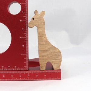 Handmade wooden giraffe cutout, unfinished, ready to paint, and freestanding. Perfect for a young child's imaginative play, stacking, or crafting.