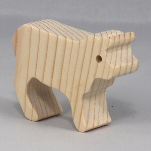 This is an unfinished wooden Calf cutout from solid wood using traditional woodworking techniques. Sanded smooth and ready to paint, stain, or customize. Freestanding design for small hands, toddlers, young children, crafters, collectors, and display. I take custom orders for any animal, quantity, and mix — including large ornament orders. Mix and match, request a different size, or send a drawing or pattern. Handmade by Odin's Toy Factory in Tallahassee, Florida, USA.