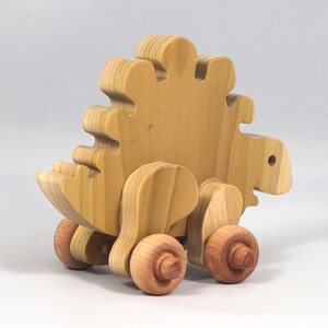 Handmade push toy stegosaurus crafted from select grade hardwoods and finished with a non-toxic coating.