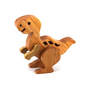 A wooden baby dinosaur figurine handmade and finished from select-grade hardwoods. It is an excellent toy for kids of any age. It is one of several dinosaurs in my collection.