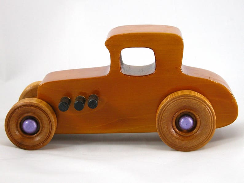 Handmade wooden toy car '27 T-Coupe, finished with amber shellac, metallic purple, and black acrylic paint. Made to order.