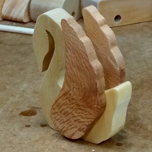 Handmade wooden swan figurine crafted from contrasting reclaimed hardwoods, sanded and ready to finish, and made in the USA.