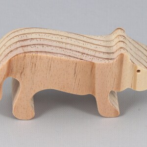 This is an unfinished wooden lioness cutout from solid wood using traditional woodworking techniques. Sanded smooth and ready to paint, stain, or customize. Freestanding design for small hands, toddlers, young children, crafters, collectors, and display. I take custom orders for any animal, quantity, and mix — including large ornament orders. Mix and match, request a different size, or send a drawing or pattern. Handmade by Odin's Toy Factory in Tallahassee, Florida, USA.