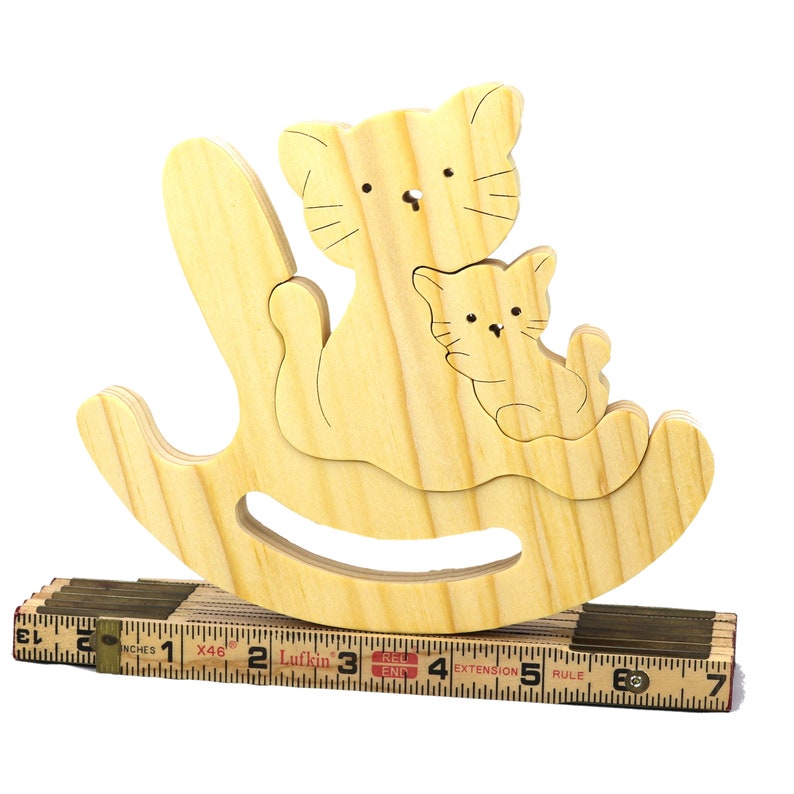 Handmade Wood Puzzle featuring Moma Cat and Baby Kitten in a Rocker, a simple three-part design crafted with traditional woodworking tools. Smoothly sanded and finished with a blend of mineral oil and beeswax for a lustrous touch.