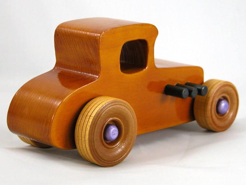 Handmade wooden toy car '27 T-Coupe, finished with amber shellac, metallic purple, and black acrylic paint. Made to order.