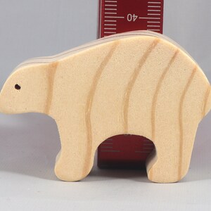 This is an unfinished wooden bear cutout from solid wood using traditional woodworking techniques. Sanded smooth and ready to paint, stain, or customize. Freestanding design for small hands, toddlers, young children, crafters, collectors, and display. I take custom orders for any animal, quantity, and mix — including large ornament orders. Mix and match, request a different size, or send a drawing or pattern. Handmade by Odin's Toy Factory in Tallahassee, Florida, USA.