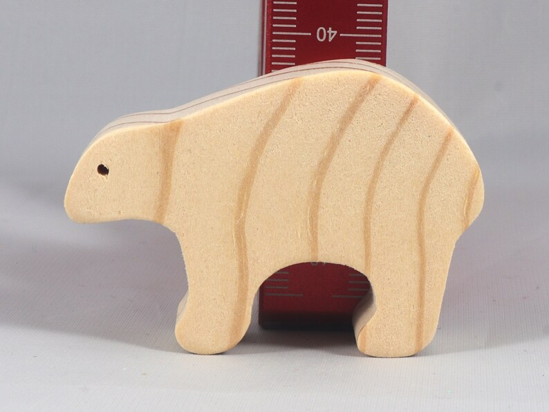 This is an unfinished wooden bear cutout from solid wood using traditional woodworking techniques. Sanded smooth and ready to paint, stain, or customize. Freestanding design for small hands, toddlers, young children, crafters, collectors, and display. I take custom orders for any animal, quantity, and mix — including large ornament orders. Mix and match, request a different size, or send a drawing or pattern. Handmade by Odin's Toy Factory in Tallahassee, Florida, USA.