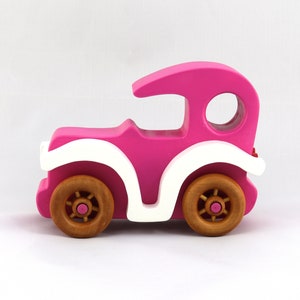 Handmade wooden toy car model-t sedan finished with hot pink and white acrylic paint with nonmaring amber shellac coated spoked wheels from my Bad Bob'S Custom Motors Collection.