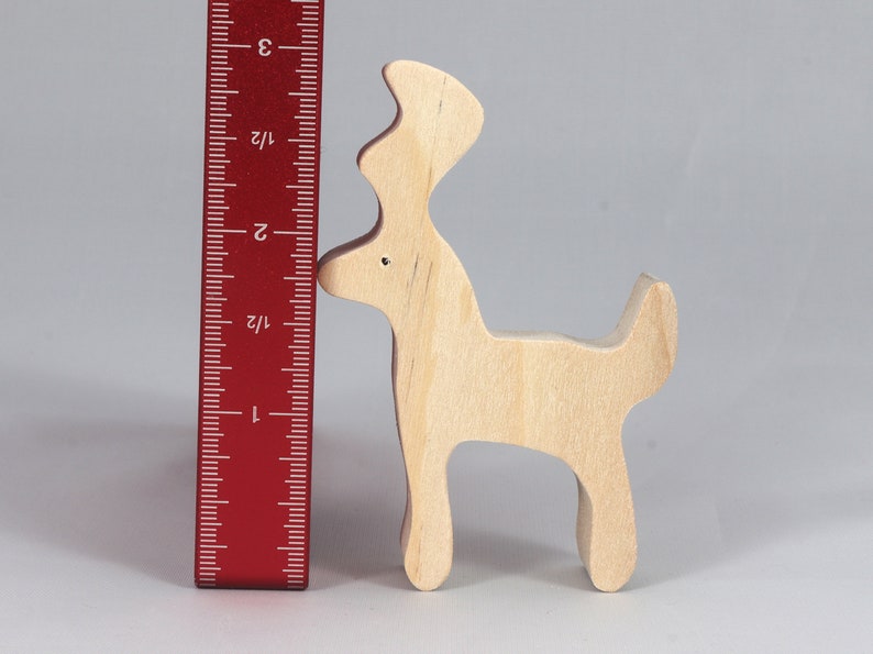 Handmade unfinished wooden deer toy figurine, part of the Itty Bitty Animal Collection, shown in natural light wood with visible grain, standing on a white background.