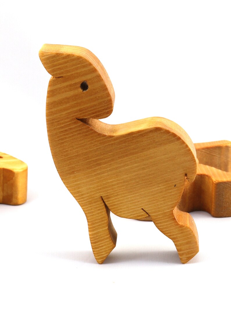 Handmade wooden toy stacking puzzle with five freestanding goats finished with a custom blend of nontoxic oils and waxes.