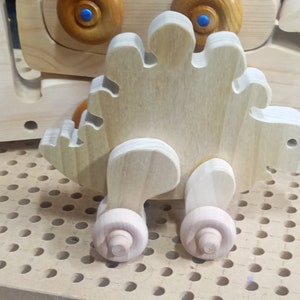 Handmade push toy stegosaurus crafted from select grade hardwoods in my toymakers shop.