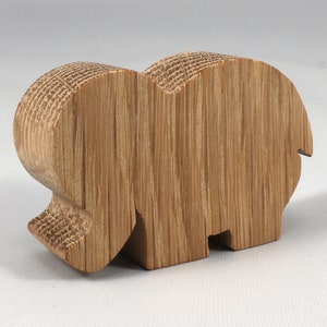Handmade wooden toy Elephant cutout from the Itty Bitty Animal Collection stackable and unfinished crafted with traditional tools in the USA. Ideal for kid's crafts or pretend play, ready to be personalized to inspire creativity and imagination.
