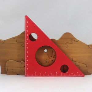 Wooden 6-piece bison family puzzle with two adult bison and four calves. The hardwood pieces interlock into one standing group or separate to stand alone. Handnmade in Tallahassee, Florida, USA by Odin's Toy Factory.