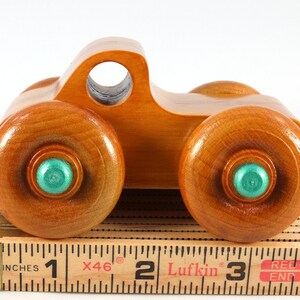Wood Toy Monster Pickup Truck handmade in the USA from select hardwood finished with amber shellac with metallic emerald green trim. From my Play Pal Collection.