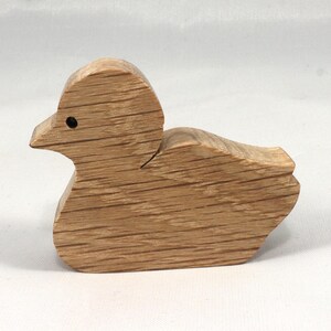 This is an unfinished wooden Duck cutout from solid wood using traditional woodworking techniques. Sanded smooth and ready to paint, stain, or customize. Freestanding design for small hands, toddlers, young children, crafters, collectors, and display. I take custom orders for any animal, quantity, and mix — including large ornament orders. Mix and match, request a different size, or send a drawing or pattern. Handmade by Odin's Toy Factory in Tallahassee, Florida, USA.