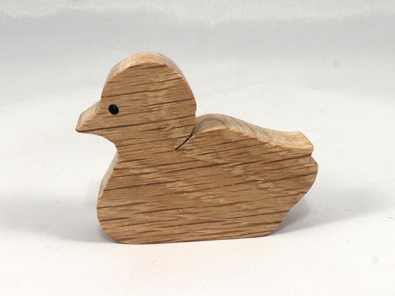 This is an unfinished wooden Duck cutout from solid wood using traditional woodworking techniques. Sanded smooth and ready to paint, stain, or customize. Freestanding design for small hands, toddlers, young children, crafters, collectors, and display. I take custom orders for any animal, quantity, and mix — including large ornament orders. Mix and match, request a different size, or send a drawing or pattern. Handmade by Odin's Toy Factory in Tallahassee, Florida, USA.