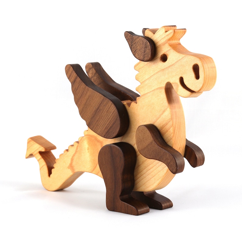 Handmade wood baby dragon fantasy animal figurine made from select grade contrasting hardwoods and hand finished with a durable custom blend of mineral oil and waxes.