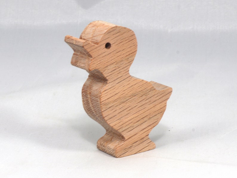 Wooden duck cutout, handmade, unfinished, and unpainted, from the Itty Bitty Animal Collection. Natural wood, freestanding, stackable, and paintable. Suitable for crafts or toys, American-made