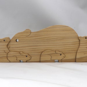 Handmade Wooden Stacking Puzzle Guinea Pig Family, Mom, and Babies finished with a non-toxic custom blend of mineral oil and waxes. This wooden toy animal is perfect for imaginative play and an excellent gift for children.