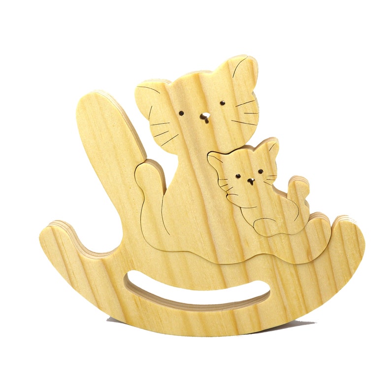 Handmade Wood Puzzle featuring Moma Cat and Baby Kitten in a Rocker, a simple three-part design crafted with traditional woodworking tools. Smoothly sanded and finished with a blend of mineral oil and beeswax for a lustrous touch.
