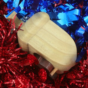 Handmade wooden miniature birdhouse ornament cut from wood with rounded edges, natural wood grain and color variations, finished with non-toxic shellac or food-safe oils and beeswax, lightweight and ready to hang. Made in Tallahassee, Florida, USA, by Odin's Toy Factory.