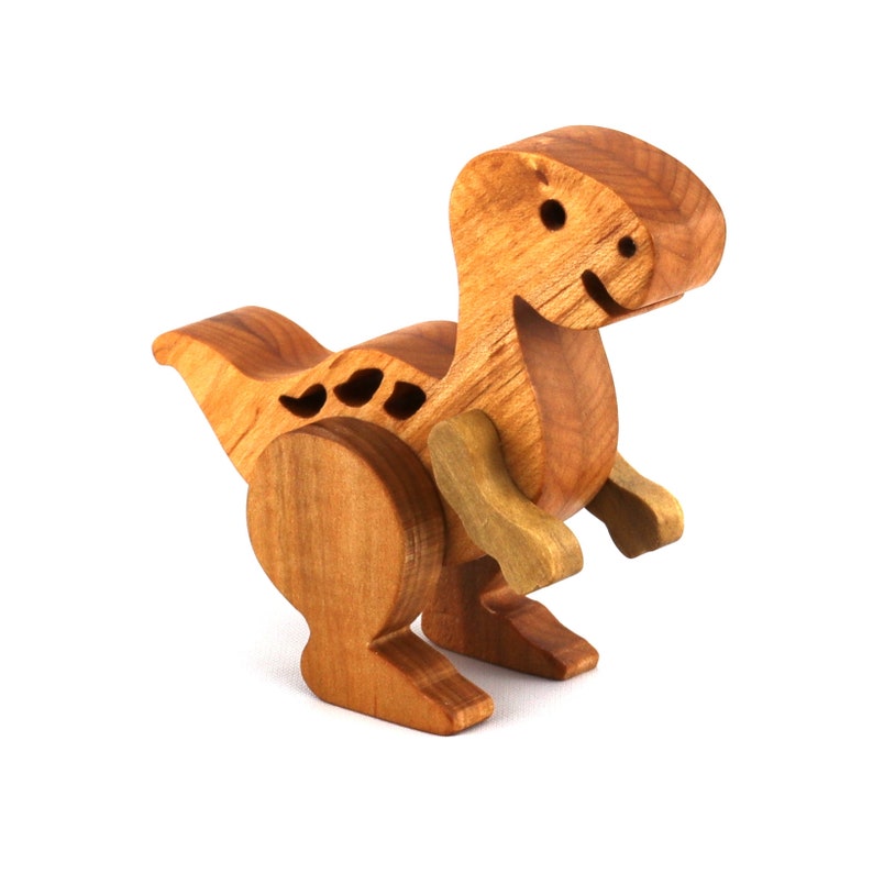Handmade wooden baby dinosaur figurines, set of 3, made from hardwood with a natural oil and wax finish. Each baby dinosaur measures approximately 3 to 4 inches in height and length. Handmade in Tallahassee, Florida, USA at Odin's Toy Factory.