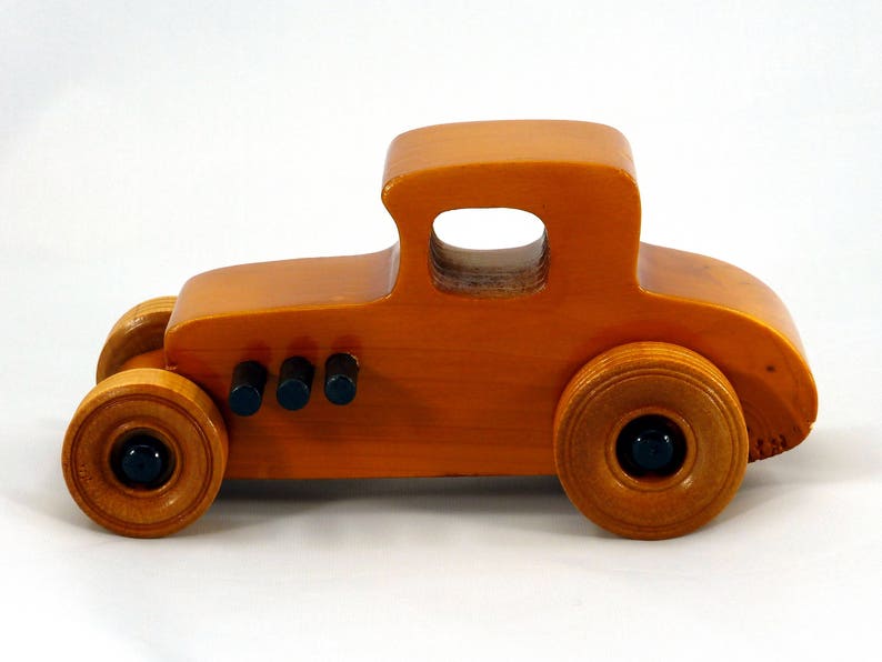Handmade Wood Toy Car Hot Rod Based On The 1927 T-Coupe. It Has Been Hand-Finished With Multiple Coats Of Amber Shellac And Trimmed With Black Acrylic Paint.