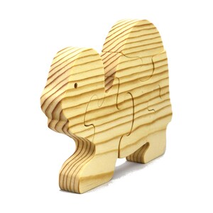 Handmade wooden turtle puzzle with 5 simple interlocking pieces. Freestanding 5-piece wooden puzzle. Approximate dimensions: 5 inches high by 7.25 inches long by 0.75 inches thick. Finished with mineral oil and beeswax blend. Handcrafted in Tallahassee, Florida, USA, using natural wood. Unique wood grain color and knot variations. Odin’s Toy Factory.