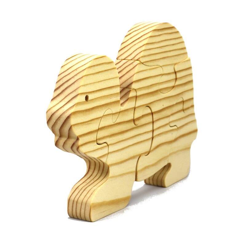 Handmade wooden turtle puzzle with 5 simple interlocking pieces. Freestanding 5-piece wooden puzzle. Approximate dimensions: 5 inches high by 7.25 inches long by 0.75 inches thick. Finished with mineral oil and beeswax blend. Handcrafted in Tallahassee, Florida, USA, using natural wood. Unique wood grain color and knot variations. Odin’s Toy Factory.