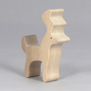 Handmade unfinished wooden deer toy figurine, part of the Itty Bitty Animal Collection, shown in natural light wood with visible grain, standing on a white background.