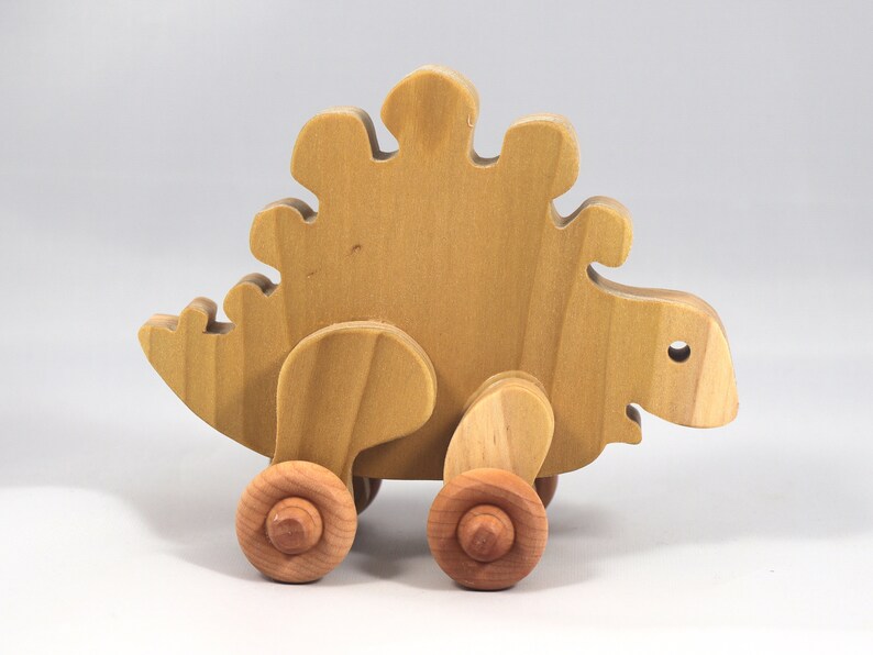 Handmade push toy stegosaurus crafted from select grade hardwoods and finished with a non-toxic coating.
