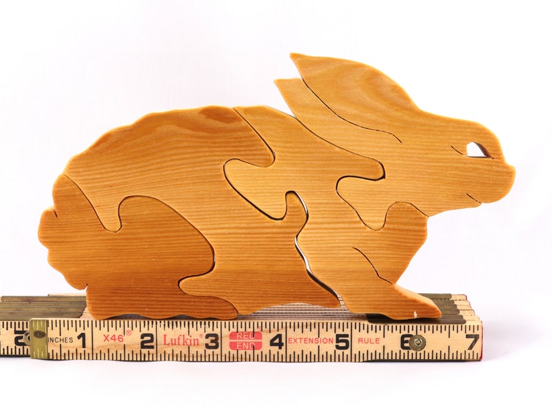 A wooden four piece puzzle in the shape of a rabbit. Perfect toddlers first puzzle.