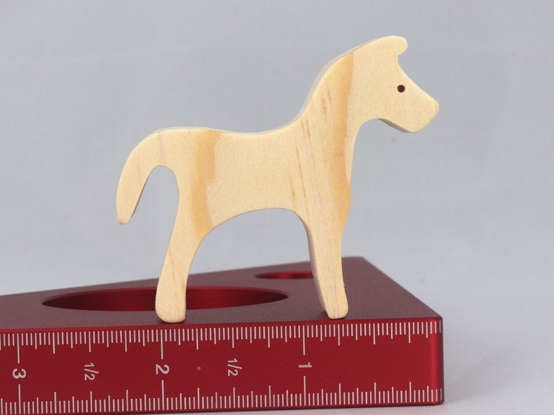 Handmade wooden toy horse cutout, perfect for children's playtime collection. Freestanding and stackable, ready to paint or customize. Endless possibilities for imaginative play, from farm scenes to towering animal creations.