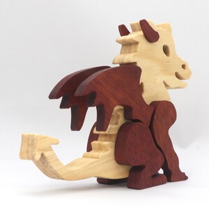 Hand-crafted baby dragon mythical fantasy animal figurine made from contrasting high-quality hardwoods and finished with non-toxic oils and waxes. Perfect for any dragon enthusiast.