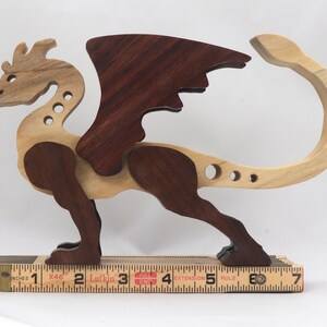 Handmade wood dragon figurine made from select grade contrasting hardwoods and hand-finished with a custom mixture of mineral oil and waxes.