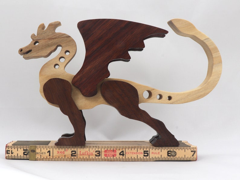 Handmade wood dragon figurine made from select grade contrasting hardwoods and hand-finished with a custom mixture of mineral oil and waxes.