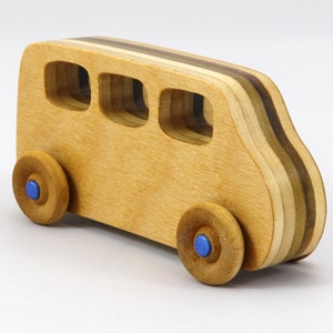 Handmade wood toy minivan made by me in my shop using traditional woodworking tools. It is hand finished with clear shellac with metallic sapphire blue acrylic paint.