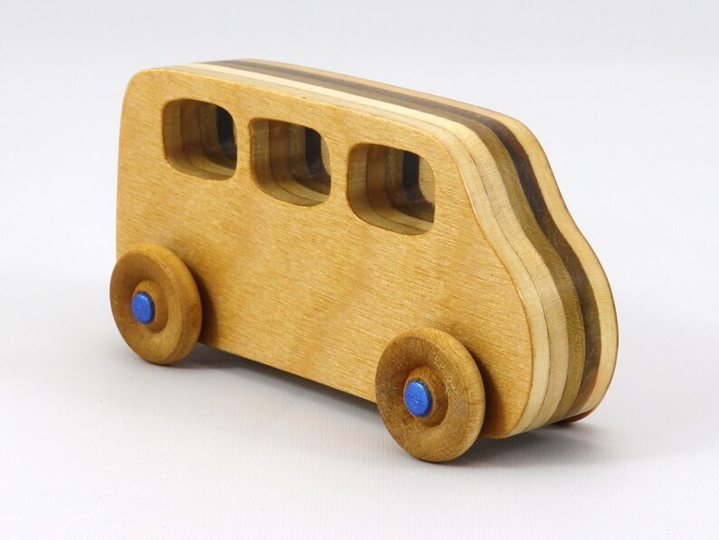 Handmade wood toy minivan made by me in my shop using traditional woodworking tools. It is hand finished with clear shellac with metallic sapphire blue acrylic paint.