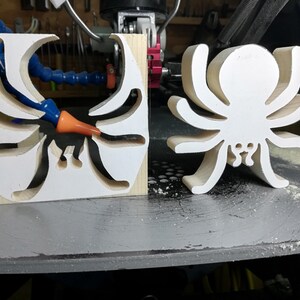 Handmade unfinished wooden Halloween spider cutout from Odin's Toy Factory Snazzy Spooks Collection. Solid wood hand-cut spider, paintable, freestanding design. Approximate size 3.5 inches height by 3.5 inches width by 0.75 inches thick. Made in Tallahassee, Florida, USA.