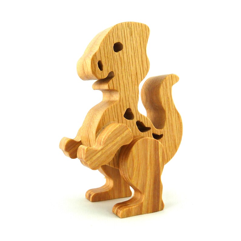 Handmade wooden baby dinosaur figurines, set of 3, made from hardwood with a natural oil and wax finish. Each baby dinosaur measures approximately 3 to 4 inches in height and length. Handmade in Tallahassee, Florida, USA at Odin's Toy Factory.