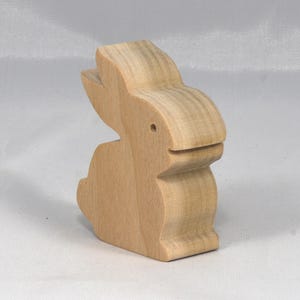 This is an unfinished wooden Rabbit cutout from solid wood using traditional woodworking techniques. Sanded smooth and ready to paint, stain, or customize. Freestanding design for small hands, toddlers, young children, crafters, collectors, and display. I take custom orders for any animal, quantity, and mix — including large ornament orders. Mix and match, request a different size, or send a drawing or pattern. Handmade by Odin's Toy Factory in Tallahassee, Florida, USA.