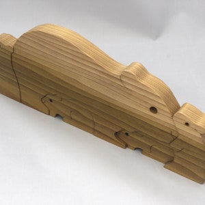 Handmade Wooden Stacking Puzzle Guinea Pig Family, Mom, and Babies finished with a non-toxic custom blend of mineral oil and waxes. This wooden toy animal is perfect for imaginative play and an excellent gift for children.