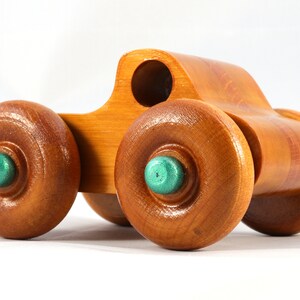 Wood Toy Monster Pickup Truck handmade in the USA from select hardwood finished with amber shellac with metallic emerald green trim. From my Play Pal Collection.