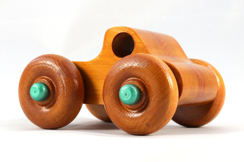 Wood Toy Monster Pickup Truck handmade in the USA from select hardwood finished with amber shellac with metallic emerald green trim. From my Play Pal Collection.